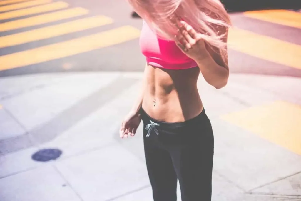 Woman with toned stomach after LA-EMS Body Sculpting Treatment Lower Sydenham